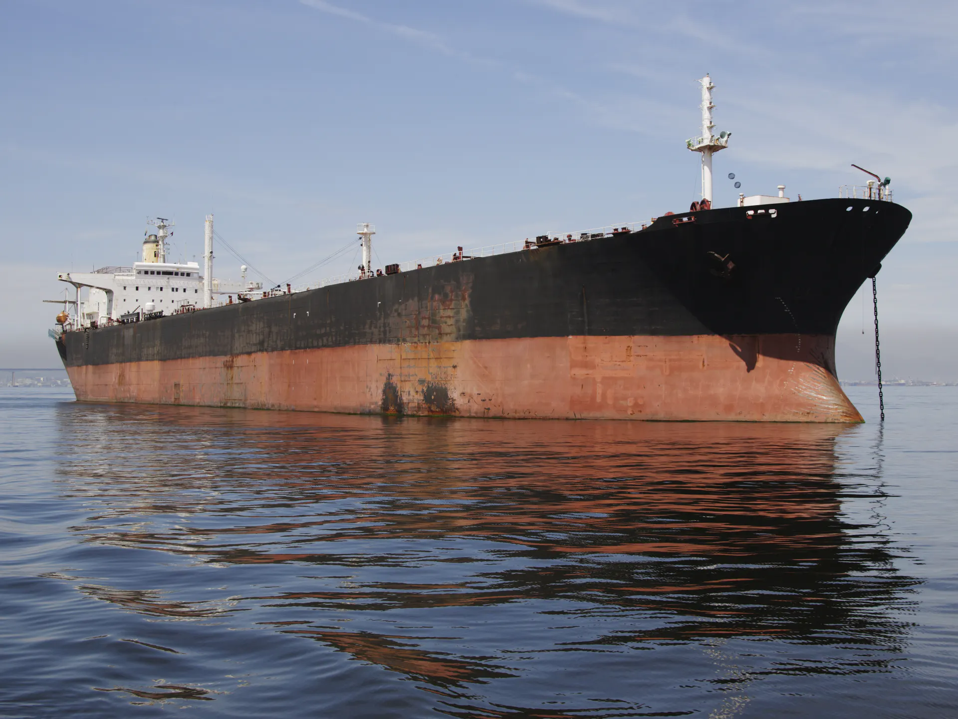 A tanker lying at anchor offshore